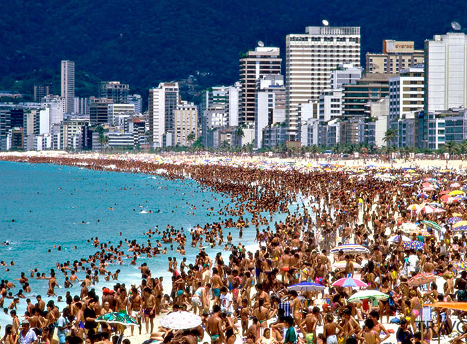 a beach packed with tourists